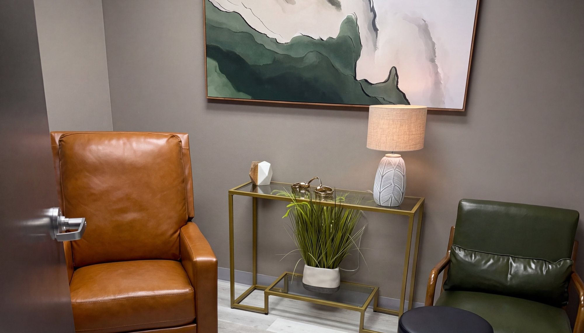 Julep consult room with a leather armchair, lamp and plant